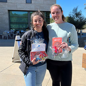 Onboarding Buddies Celeste and Cassie with their Book Club gift bags