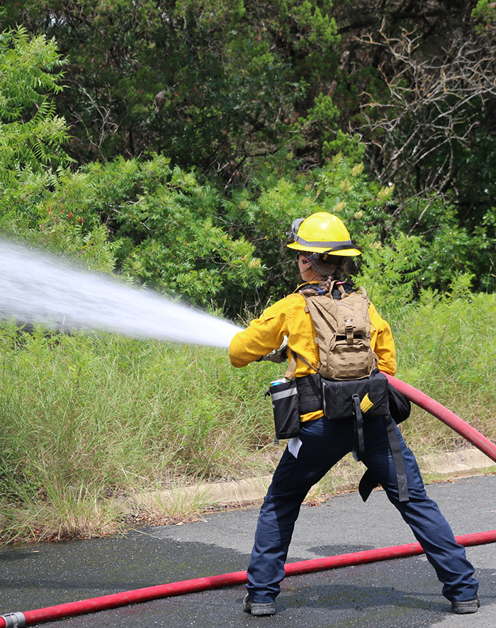 firefighter holding hose