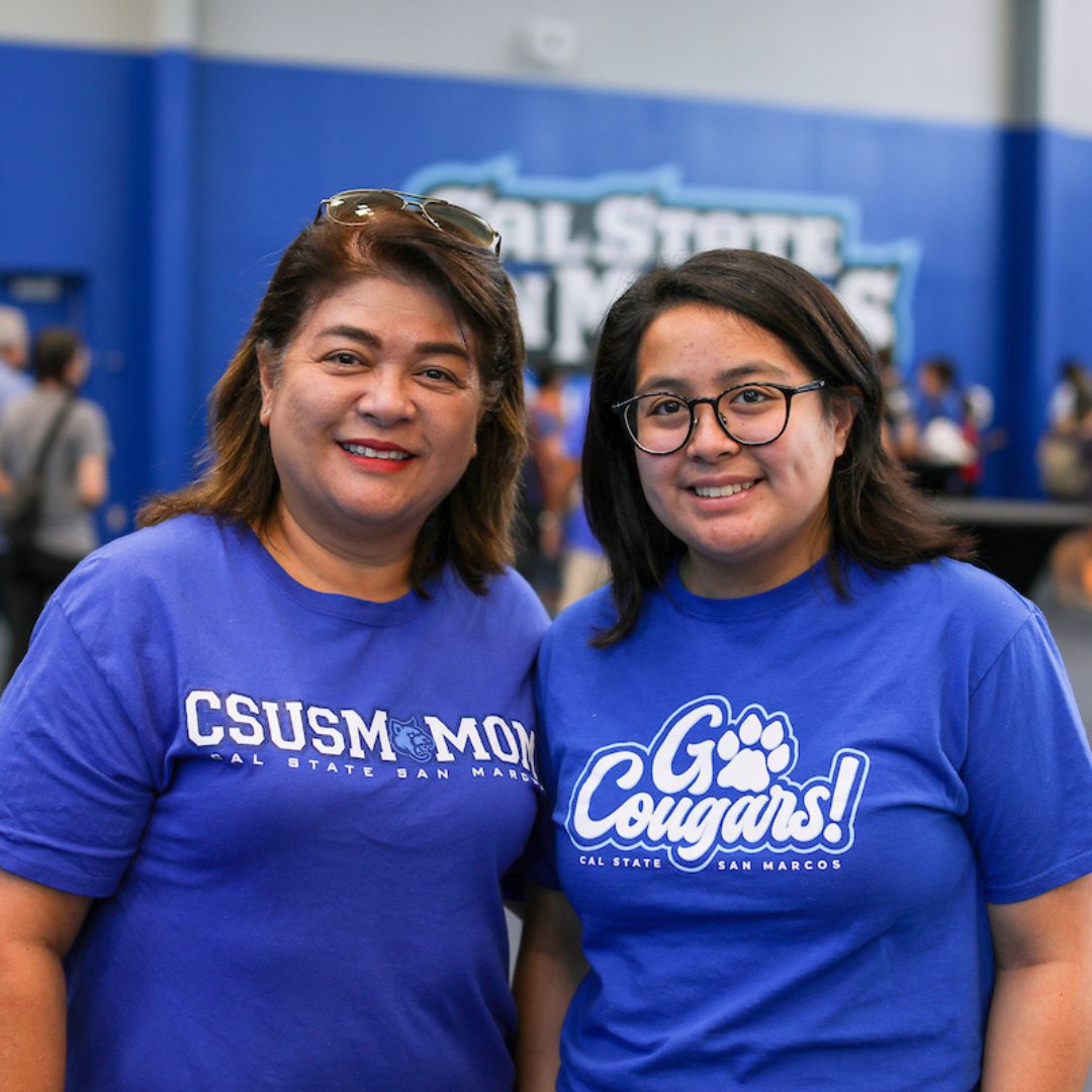two family members in csusm gym wearing csusm swag